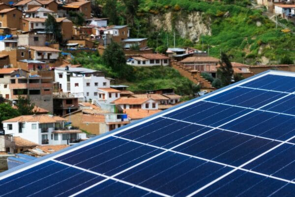 Solar panels against backdrop of Cusco in Peru