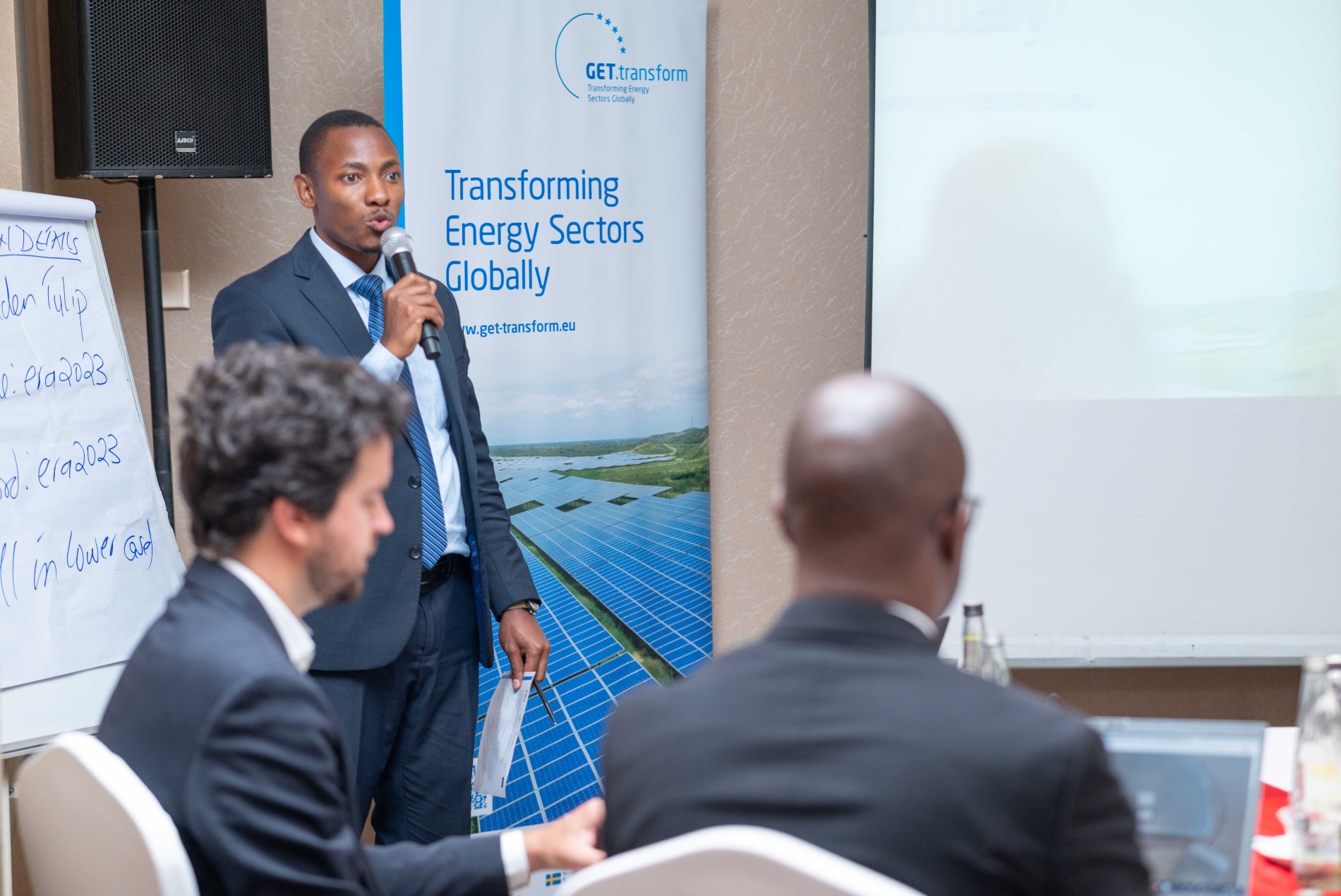 Henry Jumba of GET.transform speaking at the Stakeholder Validation Workshop for Isolated Grid System Standards hosted by ERA in Uganda in April 2023.